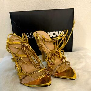 Gold heels with rhinestones and lace up